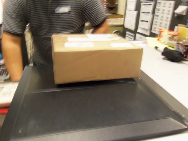 Here is the package on the scale (note: don't take pictures at the post office, or you will get a lot of questions as to what you are mailing and why it requires a picture). And now, thanks to the cogent arguments I presented to the Wrigley Corporation, I expect I will soon see a change back to lime Skittles.