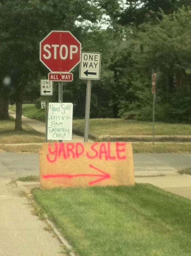 Something is wrong with this picture. If you don't see anything, look at the signs.