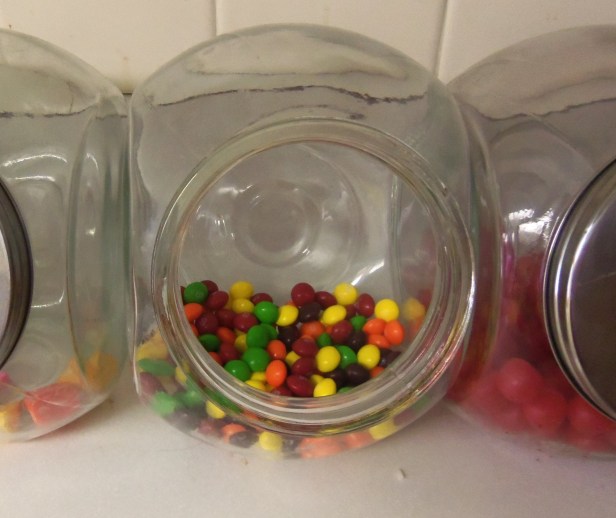 The other day, I bought some Skittles. Here they are, looking festive in one of my candy jars. I did not suspect that those green Skittles harbored a terrible, terrible secret: they were not lime, but green apple flavored.