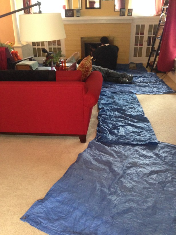 This is how the living room looked while they cleaned out the fireplace. I worried the entire time that creatures were going to start running out of the fireplace. I hung out upstairs. This is why you get married: so your husband can hang out downstairs and deal with rodents running around.