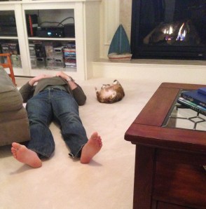 These two found a comfy place to take a rest in front of the fireplace.